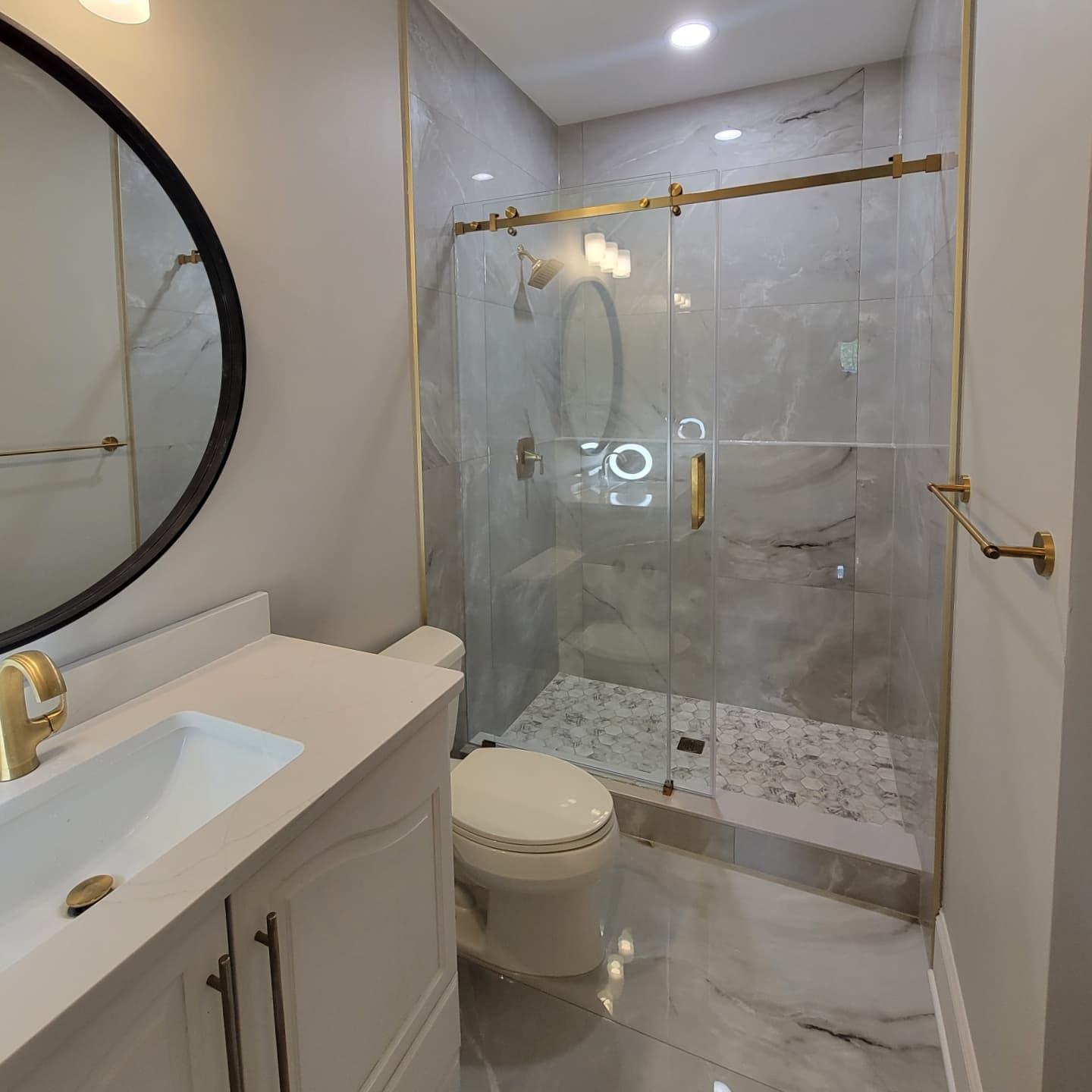 Modern bathroom with freestanding tub after remodel
